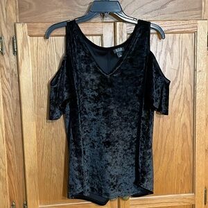 Ladies top with cutout or dropped sleeves